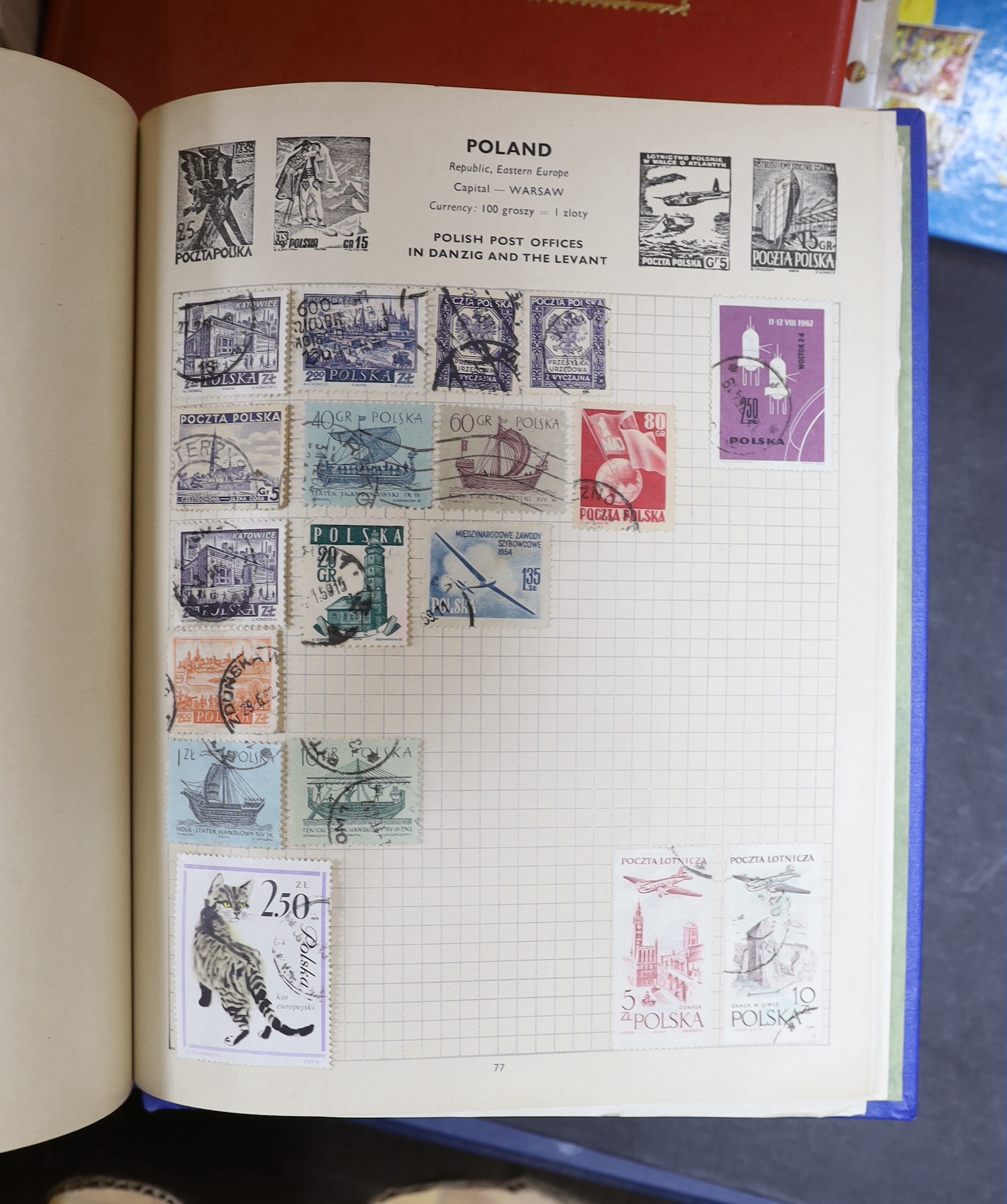 A collection of stamps arranged in albums including Romanian and Indian examples